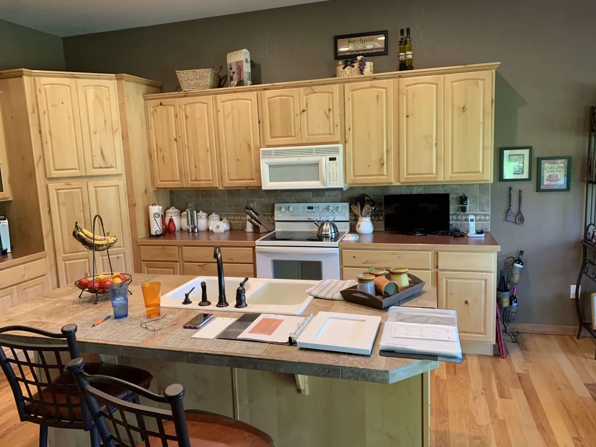 Knotty wood cabinets before refinishing